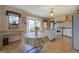 Sunny kitchen with a breakfast nook, table, and white appliances for a cozy cooking space at 650 Malcom Rd, Covington, GA 30014