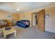 Cozy living room with carpet, ceiling fan, and doorway at 650 Malcom Rd, Covington, GA 30014