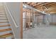 Unfinished basement with exposed wooden beams, concrete floor, and utility infrastructure at 807 Ivy Ridge Dr, Loganville, GA 30052