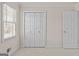 Bedroom with carpet, featuring double closets and a bright window, offering comfortable living space at 807 Ivy Ridge Dr, Loganville, GA 30052