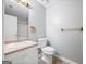 Cozy bathroom featuring a single sink vanity, window, and shower-tub combo with updated fixtures at 1620 Summit Rdg, Auburn, GA 30011