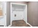 A closet with white walls, wood-look flooring, and wire shelving, offering a practical storage space at 1620 Summit Rdg, Auburn, GA 30011