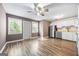 A kitchen and breakfast nook combination with hardwood flooring, white cabinets and stainless appliances at 1620 Summit Rdg, Auburn, GA 30011