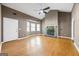 Open living room with a stone fireplace, a large bay window, and light wood flooring at 1620 Summit Rdg, Auburn, GA 30011