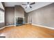 Spacious living room with a stone fireplace, high ceilings, and light wood flooring at 1620 Summit Rdg, Auburn, GA 30011