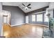 Bright living room with a stone fireplace, light wood flooring and neutral color palette at 1620 Summit Rdg, Auburn, GA 30011
