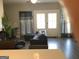 Modern living room with hardwood floors, comfortable seating, and lots of light at 1848 Eastmore Ave, Conyers, GA 30094