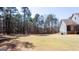 Spacious backyard featuring a storage shed and well maintained lawn near the rear of the home at 430 Gregory Rd, Covington, GA 30014