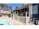 Inviting backyard with a covered porch, swimming pool, and meticulously landscaped surroundings at 430 Gregory Rd, Covington, GA 30014