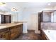 Bathroom with double sink vanity, soaking tub, and separate tiled shower at 430 Gregory Rd, Covington, GA 30014