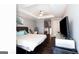 Light and airy primary bedroom with hard wood floors at 430 Gregory Rd, Covington, GA 30014