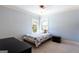 Cozy bedroom with two windows providing ample natural light and carpeted flooring at 430 Gregory Rd, Covington, GA 30014