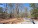 Tree-lined driveway showcasing a secluded lot, perfect for nature enthusiasts at 430 Gregory Rd, Covington, GA 30014