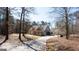 View of the paved driveway leading to a craftsman style home with a detached garage at 430 Gregory Rd, Covington, GA 30014