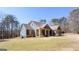 Beautiful two-story home with a blue exterior, cedar accents, and a well-manicured front lawn at 430 Gregory Rd, Covington, GA 30014