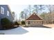 Detached garage featuring ample parking and a separate entry door at 430 Gregory Rd, Covington, GA 30014