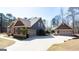 Exterior of a two car garage with a separate one car garage, joined by a paved driveway at 430 Gregory Rd, Covington, GA 30014