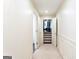 Hallway leading to a bedroom with patterned carpeted steps at 430 Gregory Rd, Covington, GA 30014