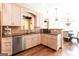 Cozy kitchen with granite counters, wood cabinets, stainless appliances, and hardwood floors at 430 Gregory Rd, Covington, GA 30014