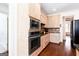 Modern kitchen with wood cabinets, stainless steel appliances and hardwood floors at 430 Gregory Rd, Covington, GA 30014