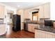 Well-equipped kitchen with wood cabinets, stainless steel appliances, and hardwood floors at 430 Gregory Rd, Covington, GA 30014