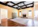 Spacious living room featuring a stone fireplace, coffered ceiling and hardwood floors at 430 Gregory Rd, Covington, GA 30014