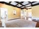 Bright living room featuring a large carpet, coffered ceiling and hardwood floors at 430 Gregory Rd, Covington, GA 30014