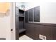 Mud room with gray storage unit, hooks and bench at 430 Gregory Rd, Covington, GA 30014