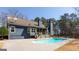 Backyard pool area with a diving board, perfect for outdoor relaxation and entertainment at 430 Gregory Rd, Covington, GA 30014