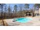 In-ground pool area with pool house, diving board, and privacy fence at 430 Gregory Rd, Covington, GA 30014