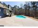 Inviting pool area surrounded by lush greenery, offering a private retreat for relaxation at 430 Gregory Rd, Covington, GA 30014