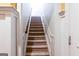 Carpeted stairs with white trim, leading to the upper level at 430 Gregory Rd, Covington, GA 30014