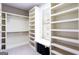 Spacious walk-in closet with custom shelving, storage, and a window seat at 430 Gregory Rd, Covington, GA 30014