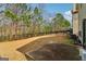 Spacious backyard with patio and mature trees at 903 Hollytree Pl, Acworth, GA 30102