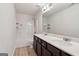 Well-lit bathroom with double sink vanity and tiled shower/tub combo at 903 Hollytree Pl, Acworth, GA 30102