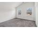 Bedroom featuring neutral carpet and two windows to allow natural light at 903 Hollytree Pl, Acworth, GA 30102