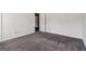 Neutral carpeted bedroom with door and window allowing natural light at 903 Hollytree Pl, Acworth, GA 30102