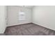 Neutral carpeted bedroom with a window to allow for natural light at 903 Hollytree Pl, Acworth, GA 30102