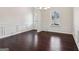 Bright dining room with dark hardwood floors, large windows, and classic white wainscoting at 903 Hollytree Pl, Acworth, GA 30102