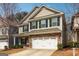 Charming two-story home with a stone-accented facade, two-car garage, and well-maintained landscaping at 903 Hollytree Pl, Acworth, GA 30102