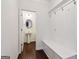Bright mudroom with a bench, coat hooks, and entry to a half bathroom at 903 Hollytree Pl, Acworth, GA 30102