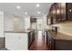 Bright kitchen with granite countertops, stainless appliances and dark wood flooring at 903 Hollytree Pl, Acworth, GA 30102