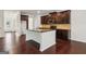 Spacious kitchen featuring an island, granite countertops and dark wood cabinets at 903 Hollytree Pl, Acworth, GA 30102