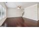 Open living room with dark hardwood floors and a staircase at 903 Hollytree Pl, Acworth, GA 30102