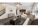 Cozy living room with a staircase, white sofas and an open layout to the kitchen and dining area at 903 Hollytree Pl, Acworth, GA 30102