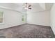 Large bedroom with a tray ceiling, neutral carpet, and plenty of natural light at 903 Hollytree Pl, Acworth, GA 30102