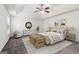 Stylized bedroom with ceiling fan, a tray ceiling, rug, and full decor at 903 Hollytree Pl, Acworth, GA 30102