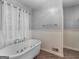 Elegant bathroom with a modern soaking tub and stylish fixtures at 1300 Lakehaven Pkwy, Mcdonough, GA 30253