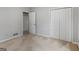 Well-lit bedroom with neutral carpeting and ample closet space at 1300 Lakehaven Pkwy, Mcdonough, GA 30253