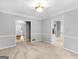 Light-filled dining room with elegant chair rail, chandelier, and view to the entry at 1300 Lakehaven Pkwy, Mcdonough, GA 30253